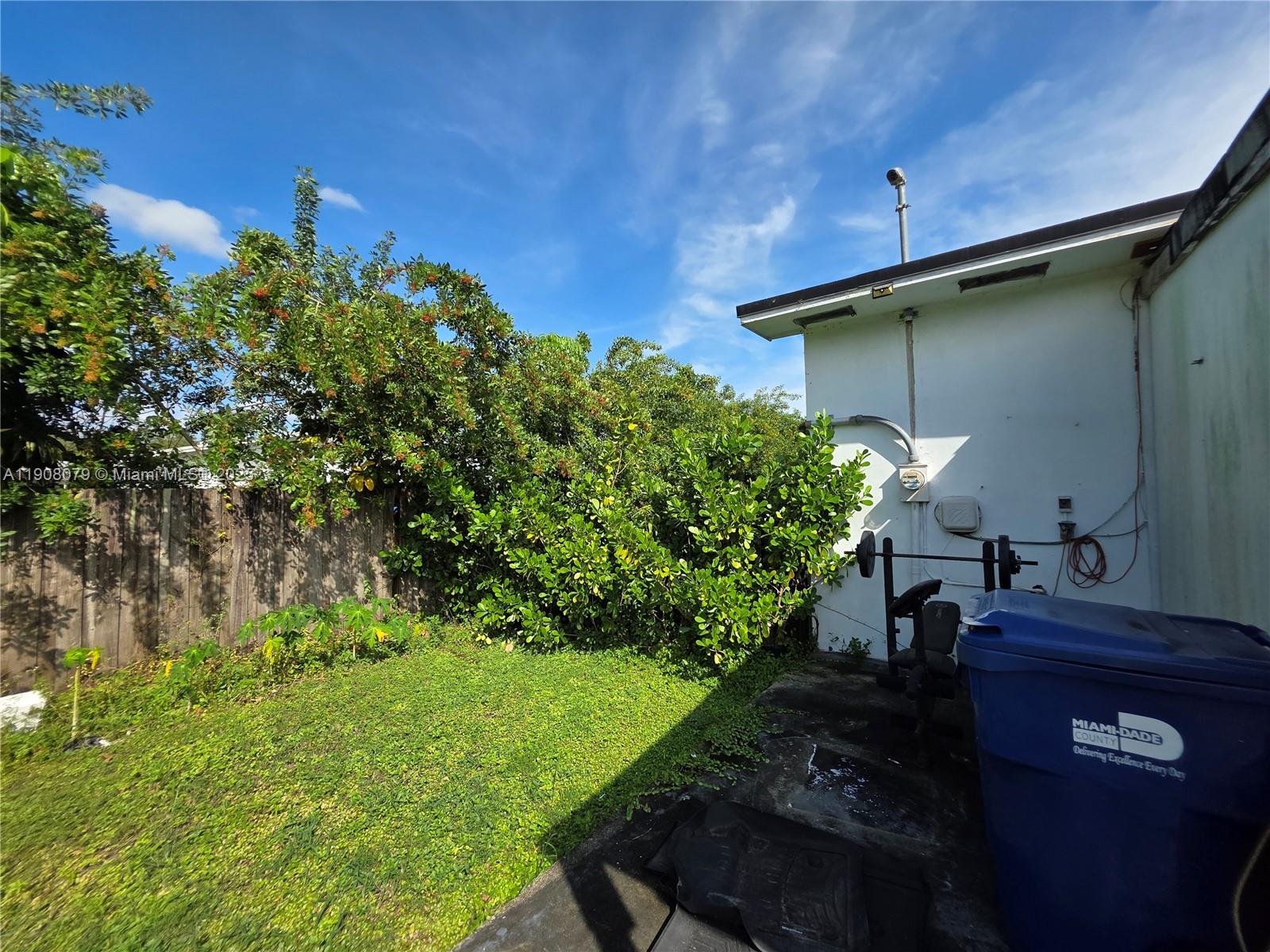 18200 Southwest 262nd Street Homestead, FL 33031 - Photo 23 of 30 a backyard of a house with lots of green space