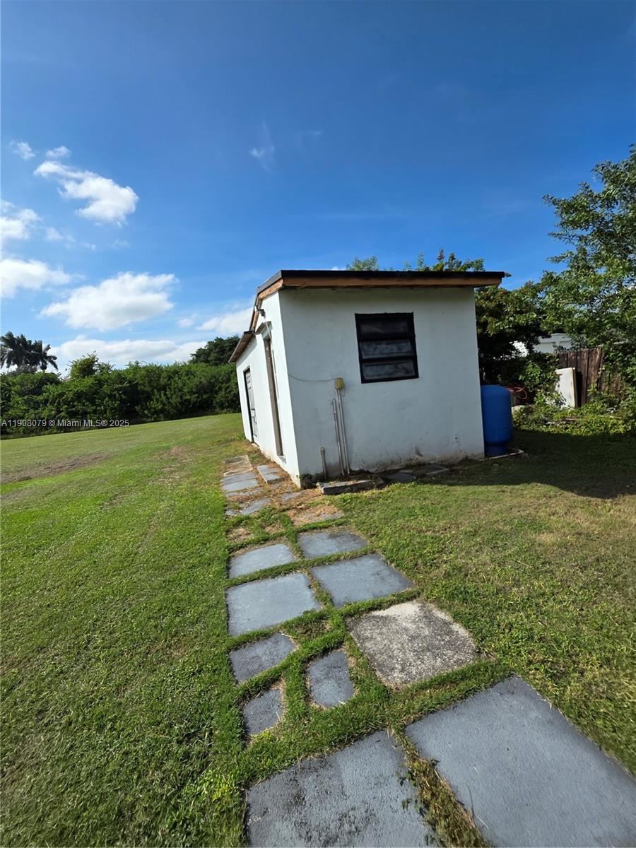 18200 Southwest 262nd Street Homestead, FL 33031 - Photo 24 of 30 a view of a backyard