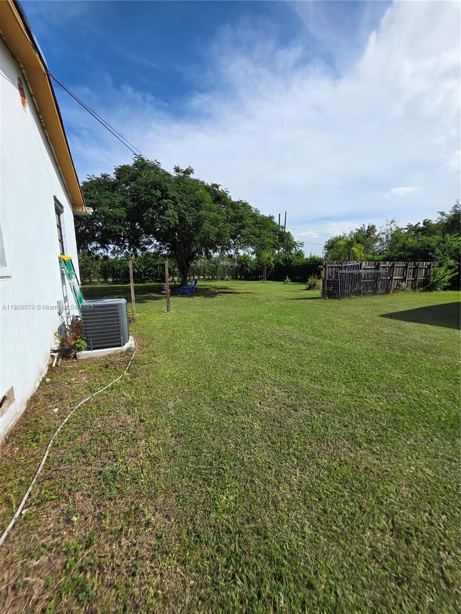 18200 Southwest 262nd Street Homestead, FL 33031 - Photo 29 of 30 a view of a field of grass and trees