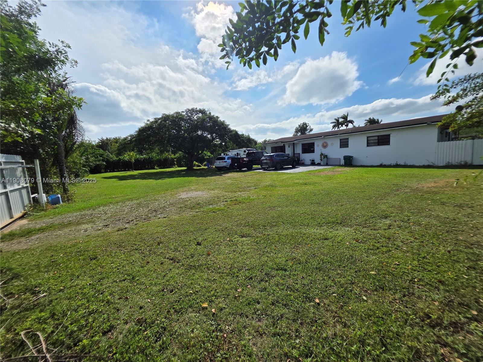 18200 Southwest 262nd Street Homestead, FL 33031 - Photo 3 of 30 a view of a big yard with a house