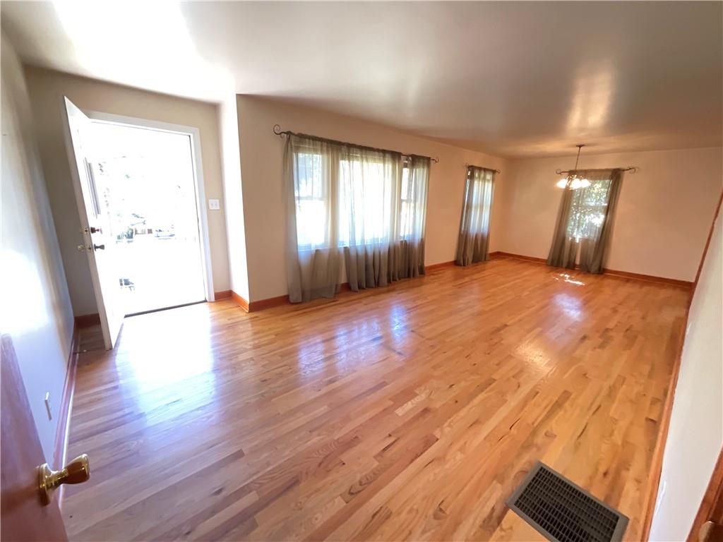2492 Hunting Valley Drive Decatur, GA 30033 - Photo 12 of 30 an empty room with wooden floor and windows