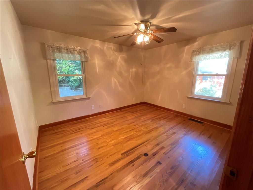 2492 Hunting Valley Drive Decatur, GA 30033 - Photo 18 of 30 a view of an empty room with wooden floor and a window