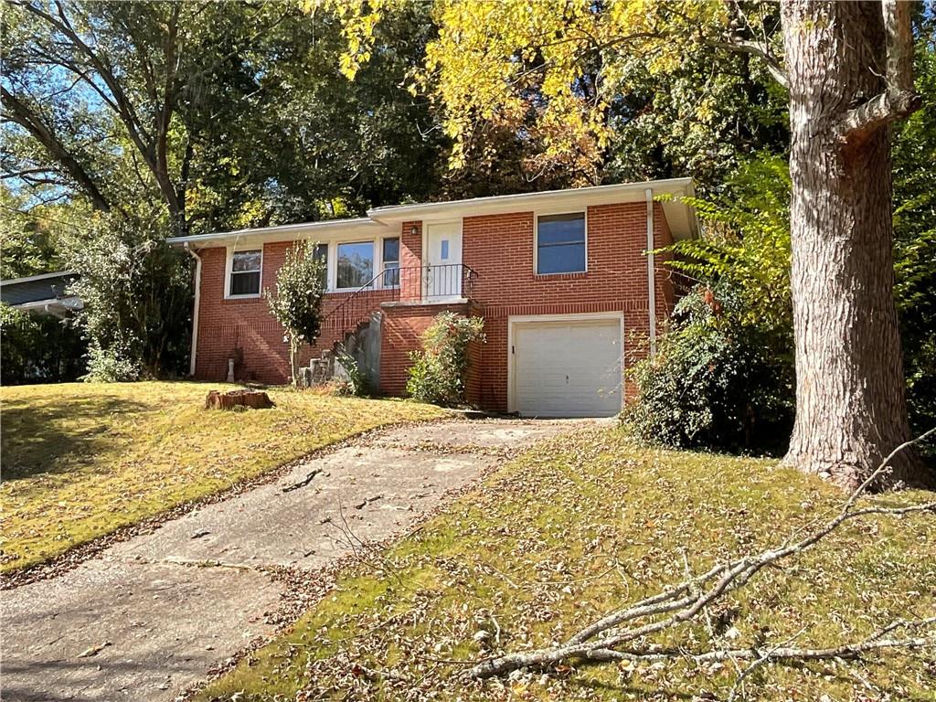2492 Hunting Valley Drive Decatur, GA 30033 - Photo 2 of 30 a front view of a house with a yard