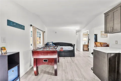 a bed room with a bed and a television