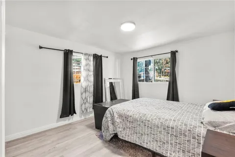 a bedroom with a large bed and a window