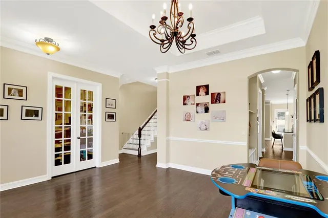 a bedroom with furniture and a window