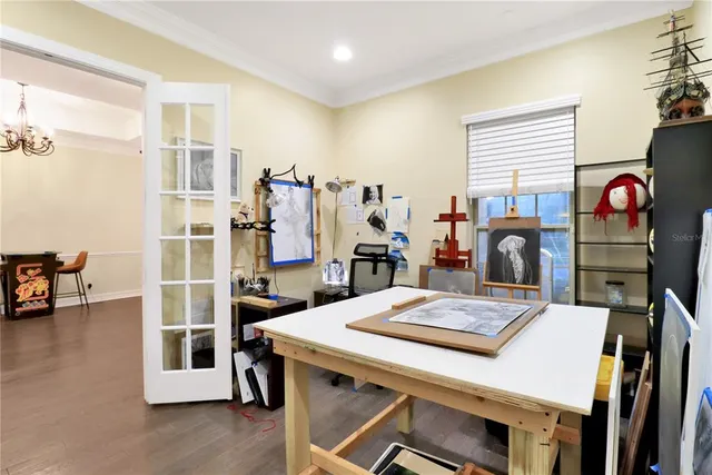 a large kitchen with stainless steel appliances lots of counter space and a sink