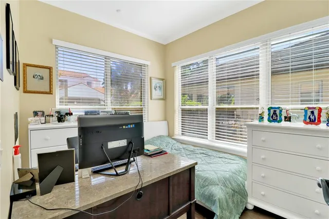 a bathroom with a granite countertop sink mirror vanity and toilet