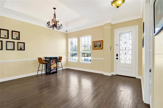 a view of a livingroom with furniture window and wooden floor
