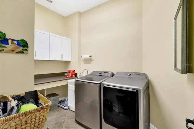 a view of a chairs and table in backyard of the house
