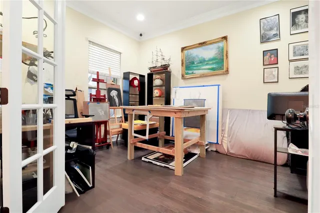 a bedroom with furniture and a window