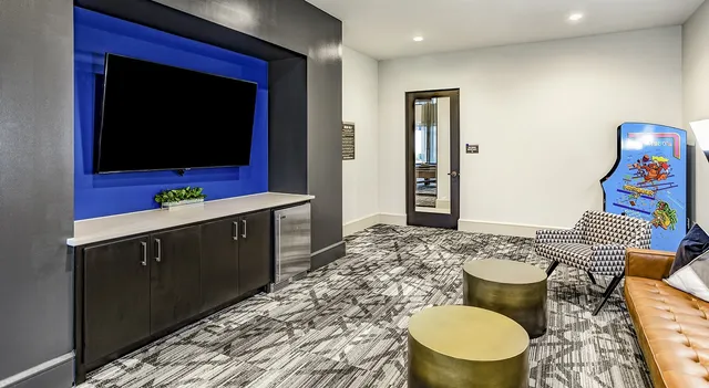 a bathroom with a toilet a sink and a mirror