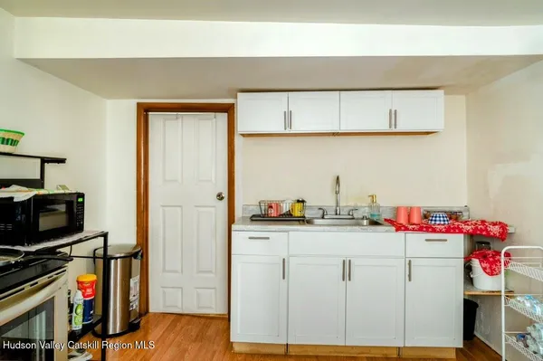 a utility room with sink dryer and washer