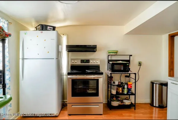 a kitchen with stainless steel appliances a stove and a refrigerator