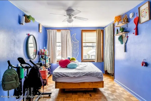 a bedroom with bed and a window