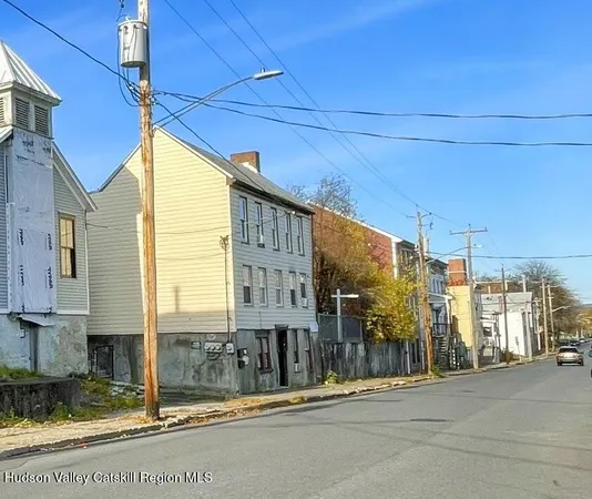 a view of a street with a building in the background