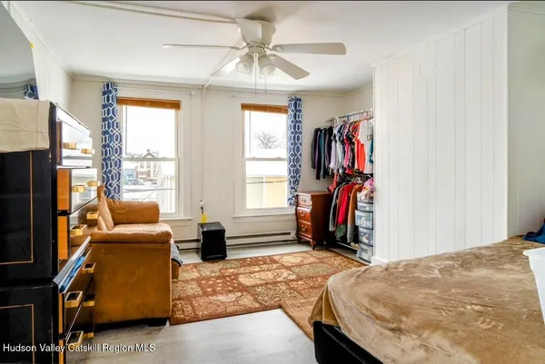 a bedroom with bed and a window