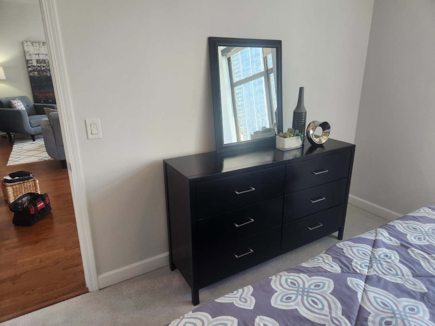 233 East 13th Street, Unit 2210 Chicago, IL 60605 - Photo 14 of 28 a room with a dresser and a mirror