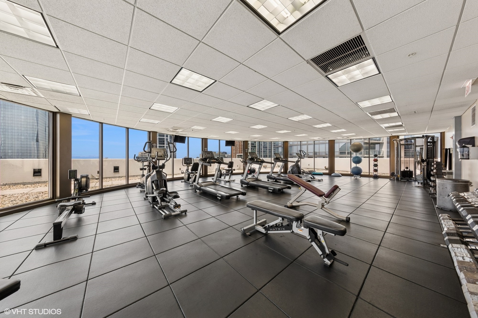 233 East 13th Street, Unit 2210 Chicago, IL 60605 - Photo 25 of 28 a room with lots of chairs and mirrors