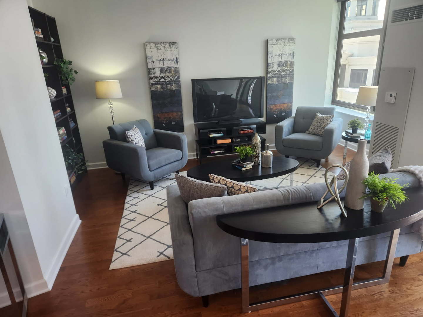 233 East 13th Street, Unit 2210 Chicago, IL 60605 - Photo 3 of 28 a living room with furniture and a flat screen tv
