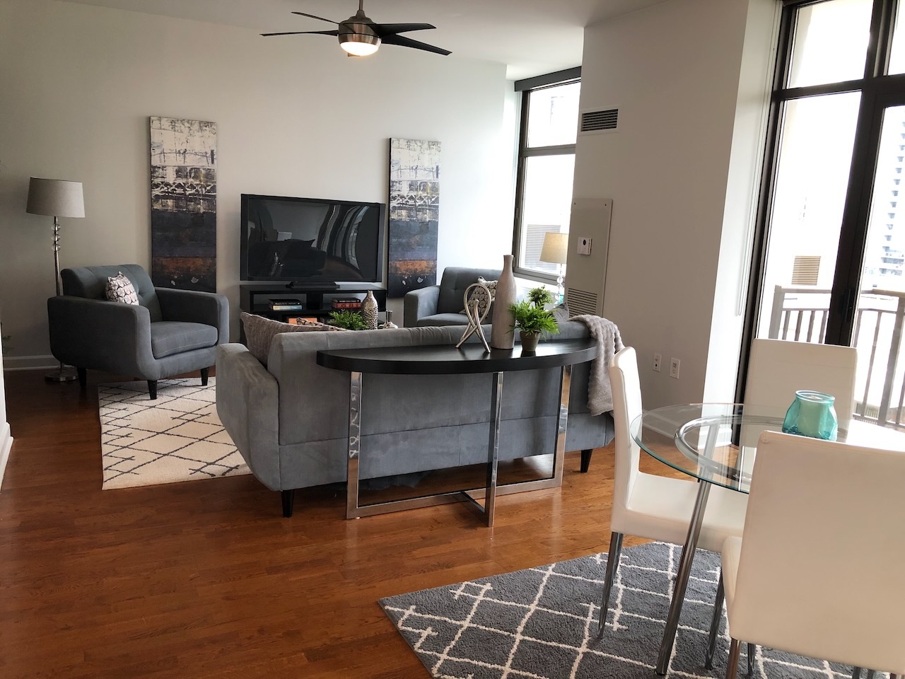233 East 13th Street, Unit 2210 Chicago, IL 60605 - Photo 7 of 28 a living room with furniture and a flat screen tv