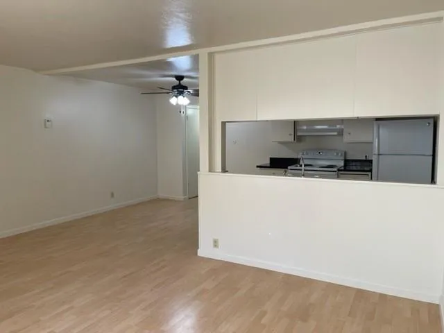 a view of cabinets and wooden floor