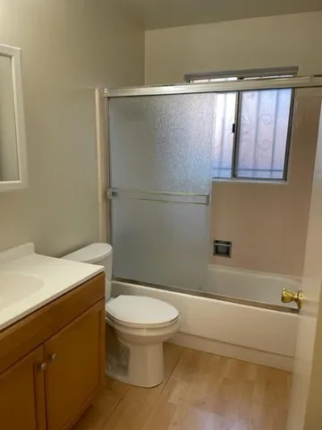 a bathroom with a sink a toilet and a bathtub