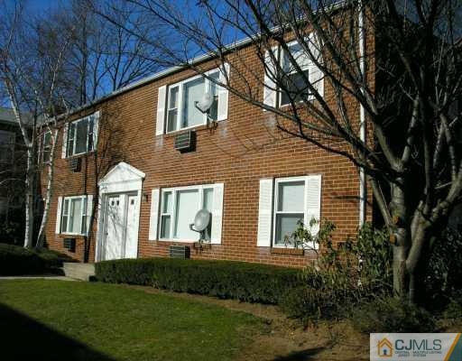 50 Fox Road, Unit 8A Edison, NJ 08817 - Photo 1 of 8 a front view of a house with a yard