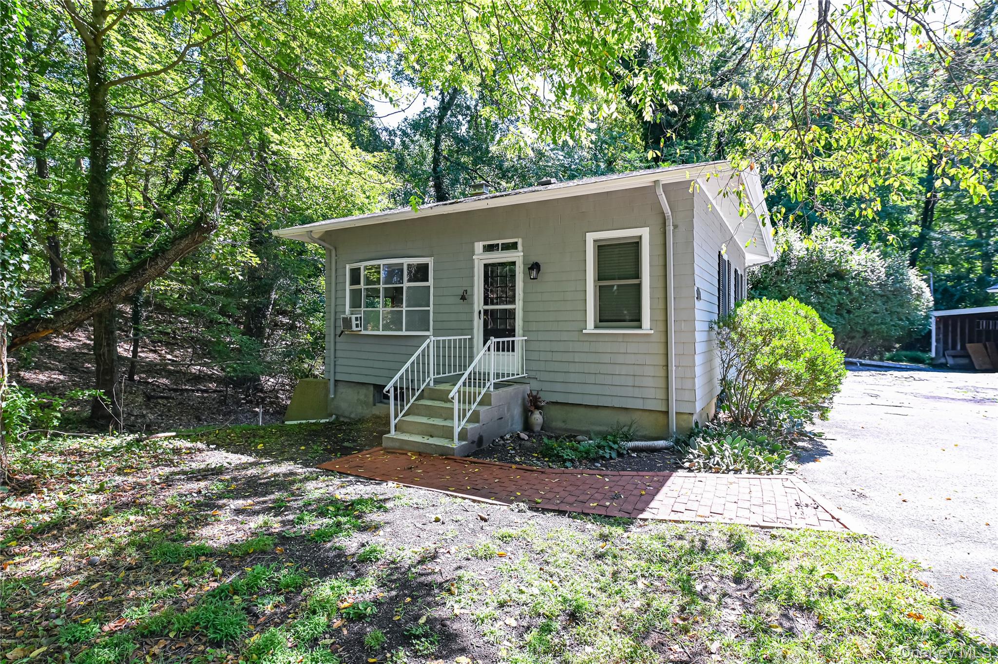 139 Cove Neck Road Oyster Bay, NY 11771 - Photo 1 of 1 a backyard of a house with yard and outdoor seating