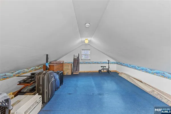 a view of room with stairs and a window