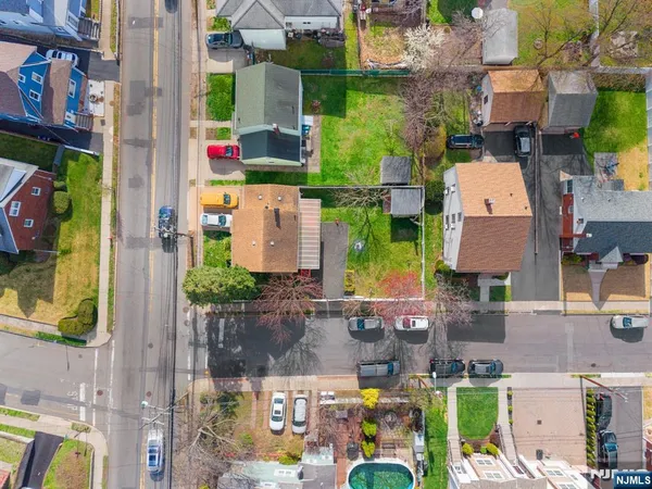 an aerial view of houses with outdoor space