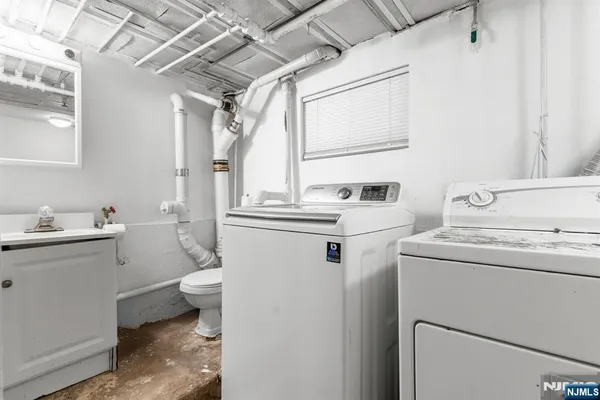 a view of bathroom with a sink and a toilet
