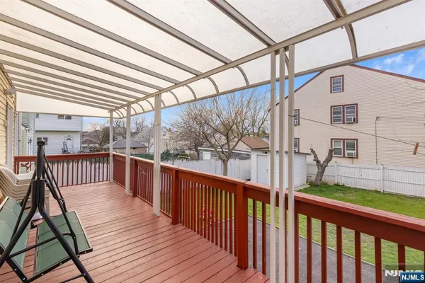 a view of a balcony with wooden floor