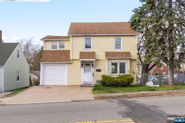 front view of a house and a yard