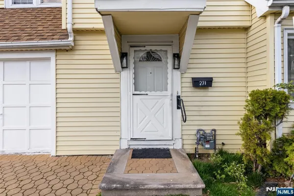 a front view of a house with a white door
