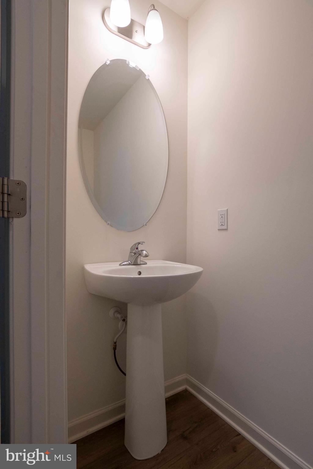 15 Pitch Pine Bunker Hill, WV 25413 - Photo 24 of 37 a bathroom with a sink and mirror
