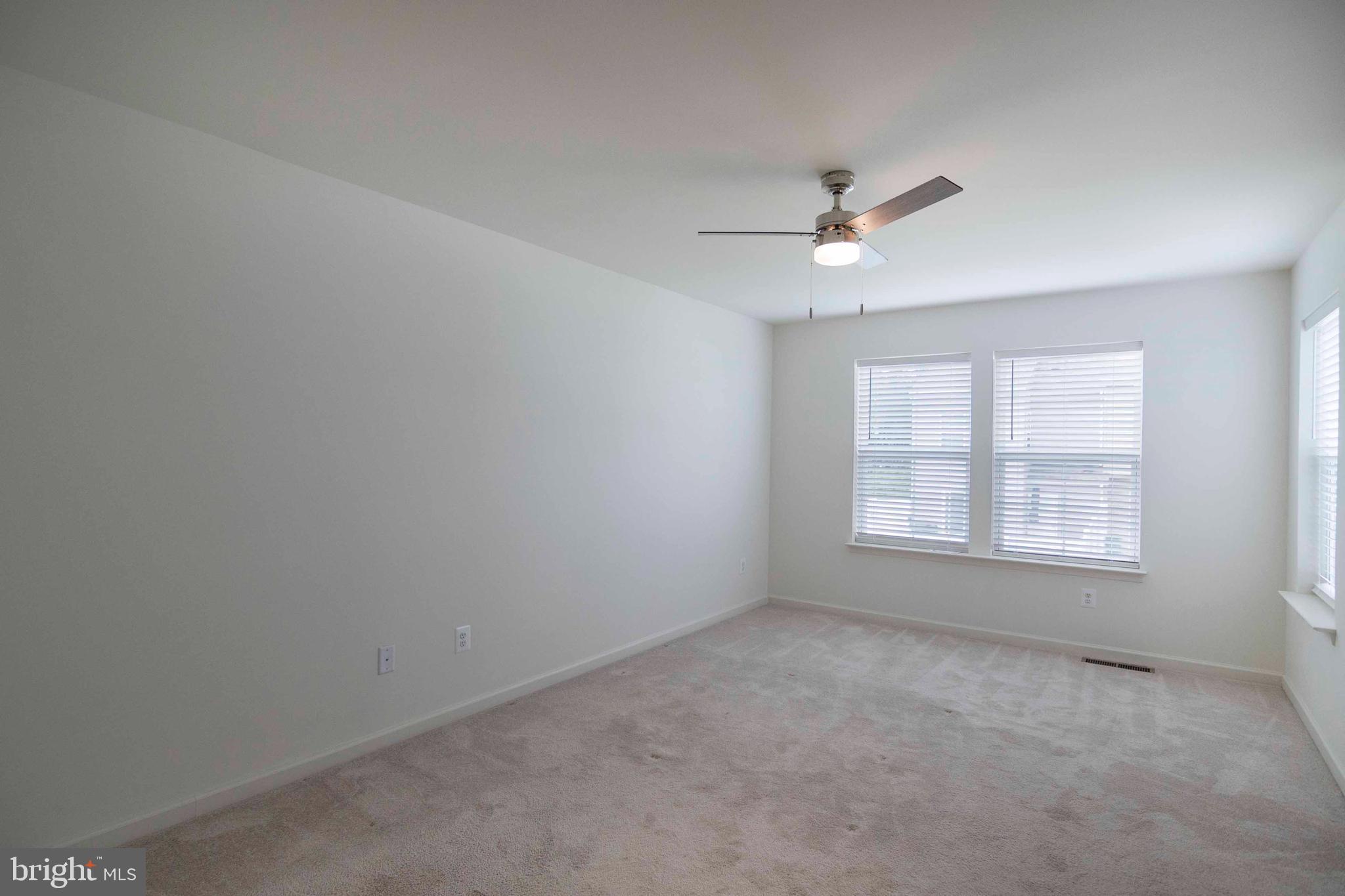 15 Pitch Pine Bunker Hill, WV 25413 - Photo 25 of 37 an empty room with a window and a ceiling fan