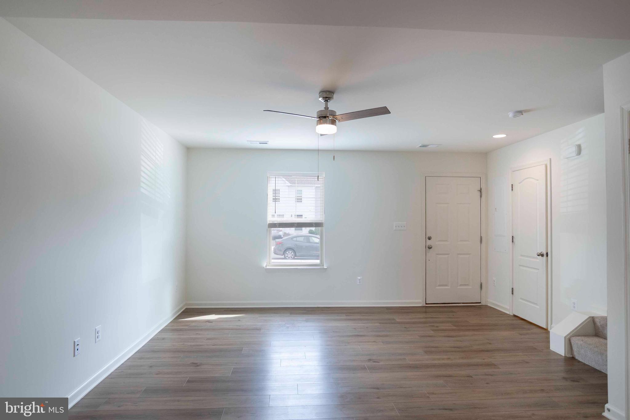 15 Pitch Pine Bunker Hill, WV 25413 - Photo 5 of 37 a view of an empty room with a window and wooden floor