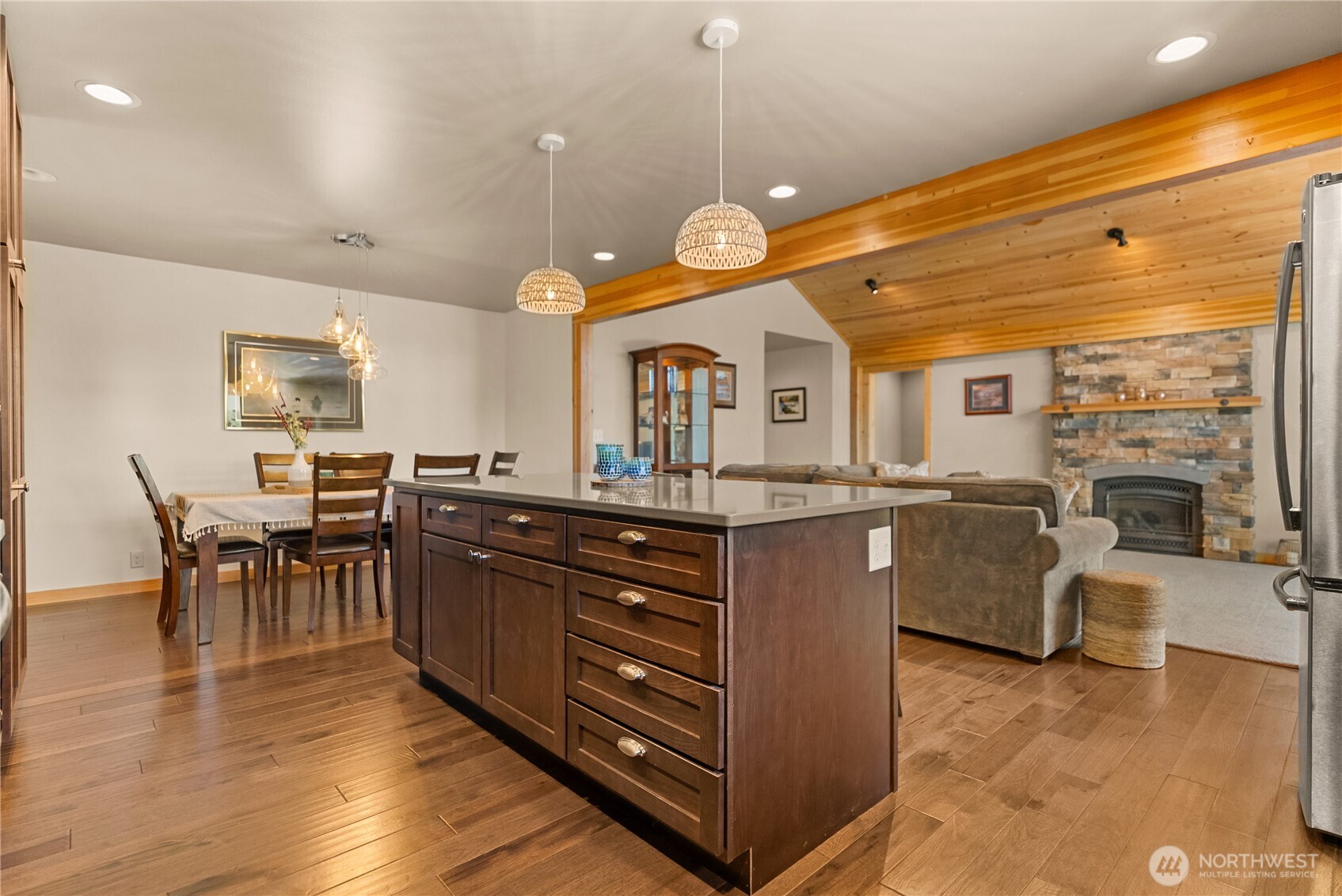 130 Sundown Road Winthrop, WA 98862 - Photo 12 of 40 a large kitchen with lots of counter space dining table and chairs