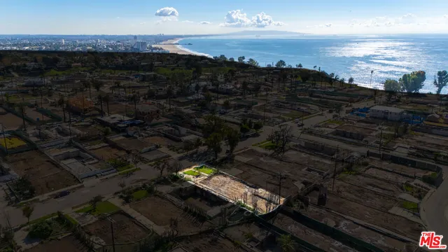 a view of roof with wooden floor and city view