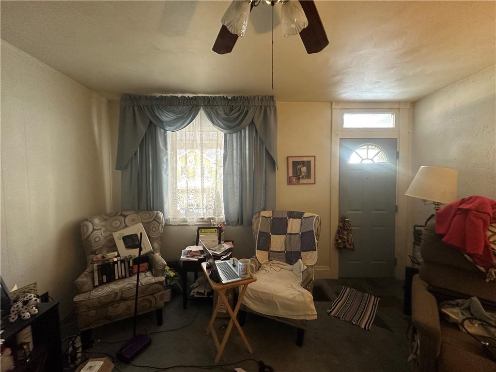83 Frazier Avenue McKees Rocks, PA 15136 - Photo 12 of 27 a living room with furniture and a window