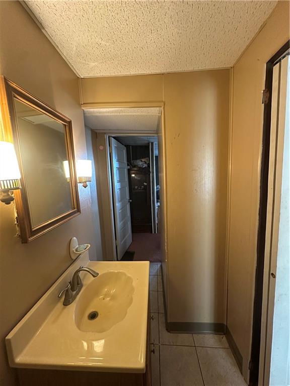 83 Frazier Avenue McKees Rocks, PA 15136 - Photo 18 of 27 a bathroom with a sink and mirror