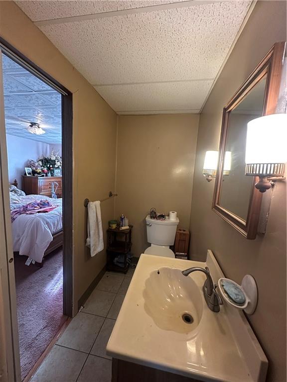 83 Frazier Avenue McKees Rocks, PA 15136 - Photo 19 of 27 a en suite bathroom with a sink and mirror