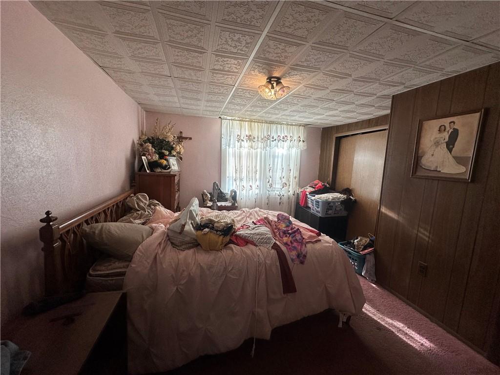 83 Frazier Avenue McKees Rocks, PA 15136 - Photo 23 of 27 a bed sitting in a bedroom next to a window