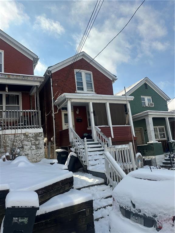 83 Frazier Avenue McKees Rocks, PA 15136 - Photo 3 of 27 a front view of a house with balcony
