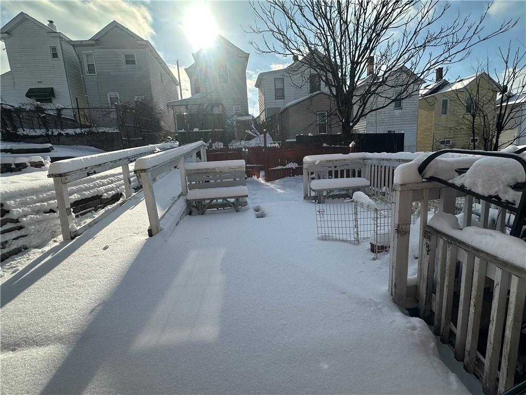 83 Frazier Avenue McKees Rocks, PA 15136 - Photo 5 of 27 a roof deck with couches and wooden floor