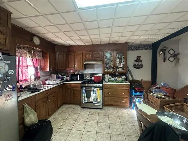 a kitchen with a stove and a refrigerator