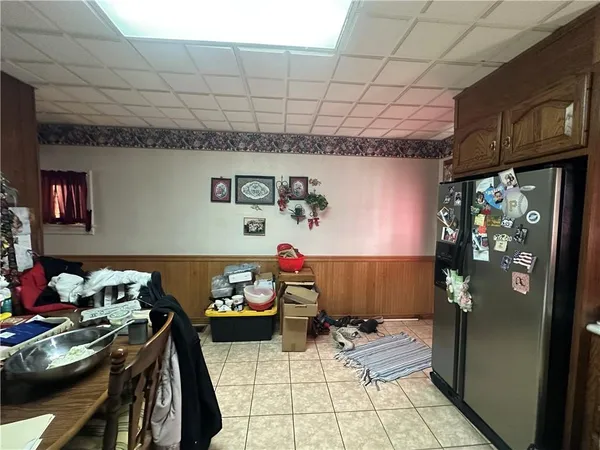 a storage room with lots of furniture and clutter