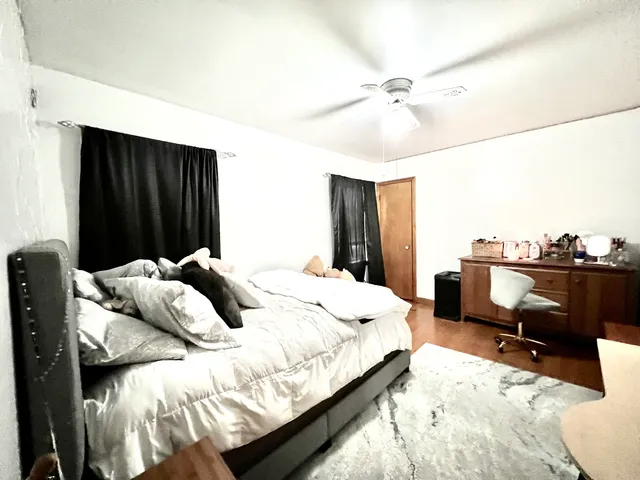 a bedroom with a bed and a dresser
