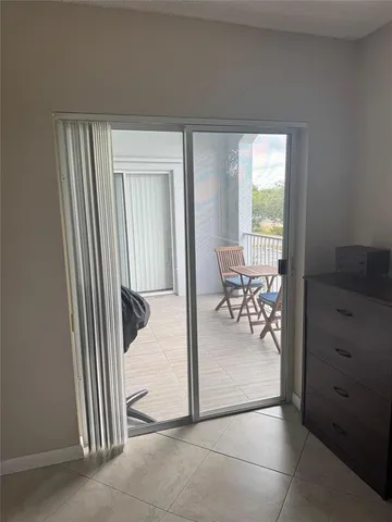 a bathroom with a sink a toilet a mirror and shower